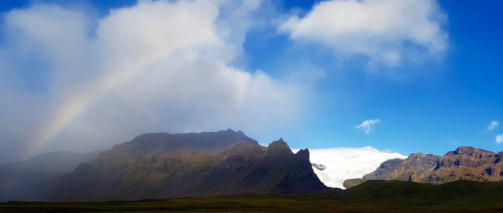 Rainbow over glacier Iceland