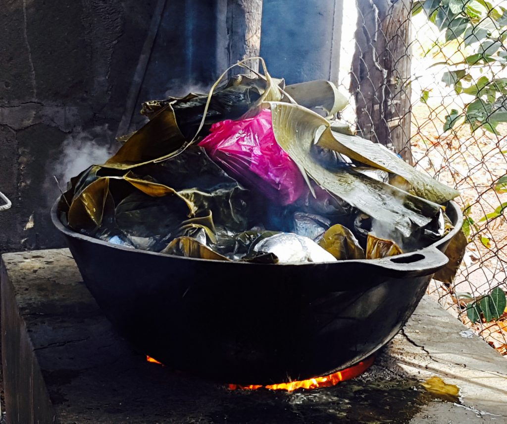 nacatamales cooking in a backyard in San Juan del Sur