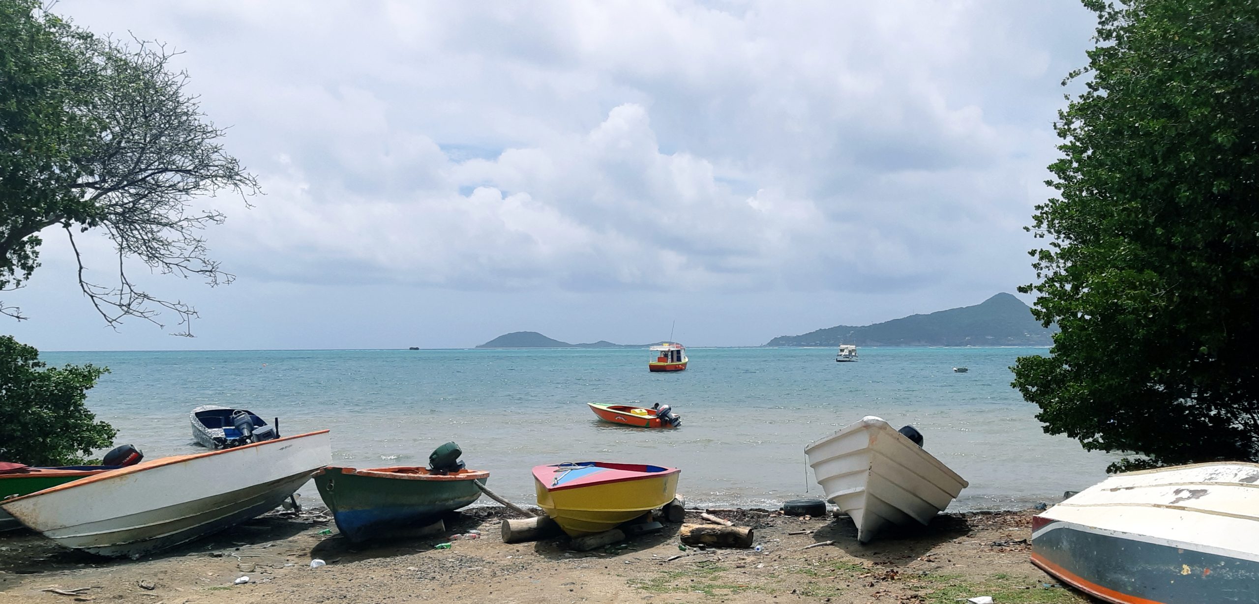 Scenes of the water from a beach in Windward