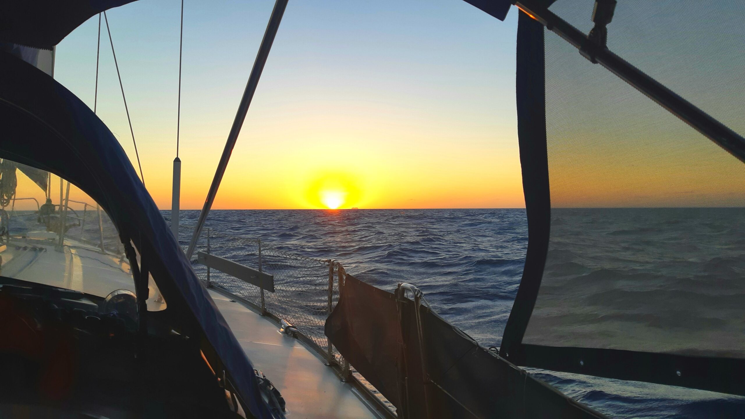 Sunset on a sailboat on the ocean