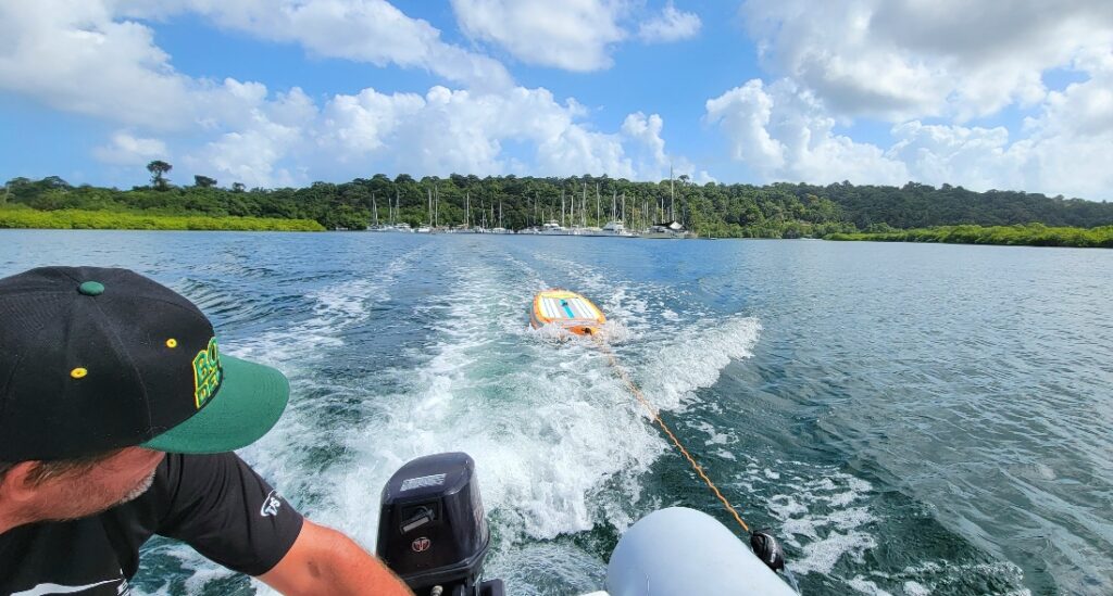 SUP behind dinghy