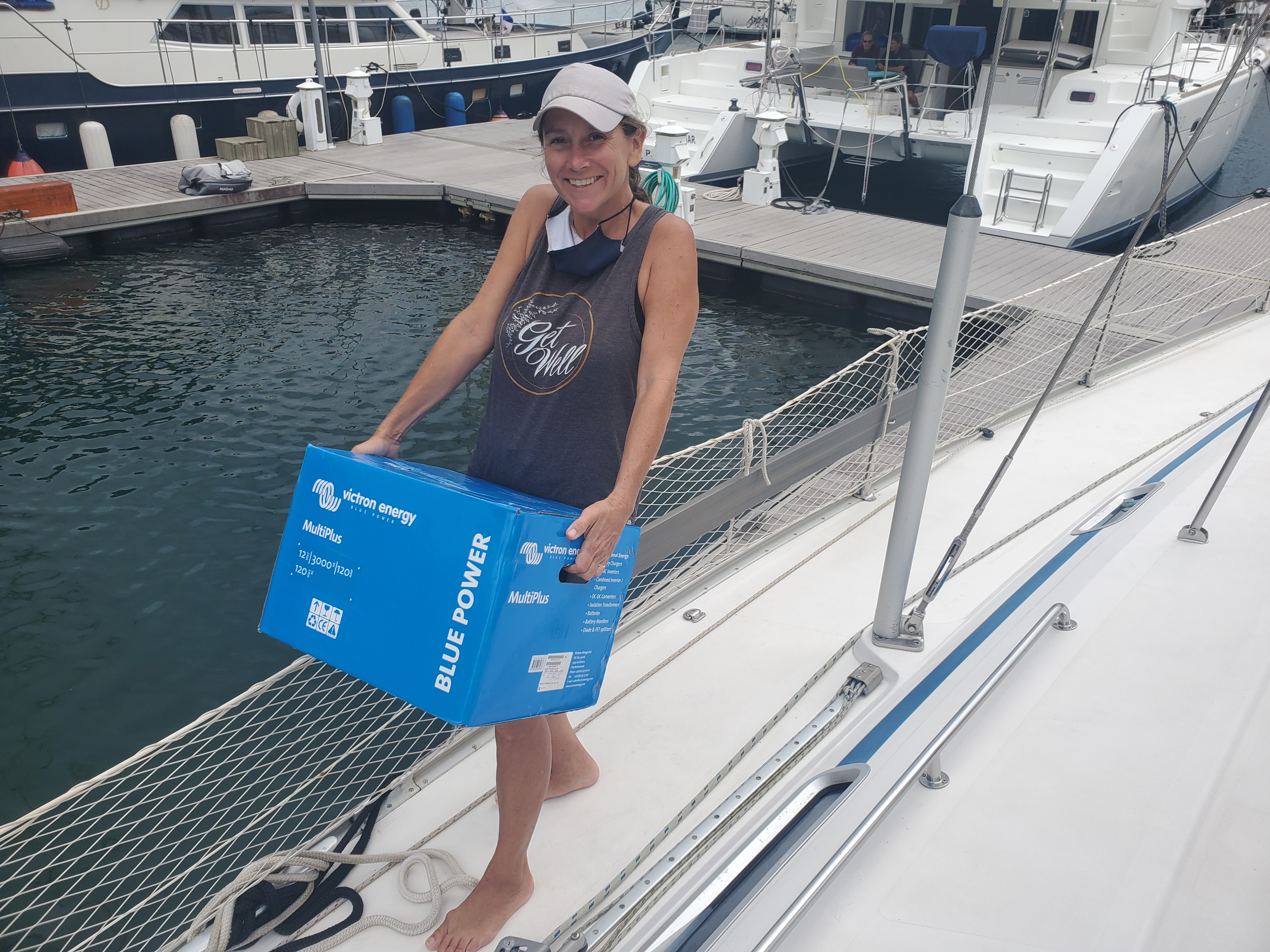 Melinda carrying a new lithium multi-charger/inverter on Sava