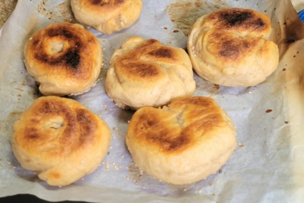 Sourdough bagels cooking on a boat during rainy season