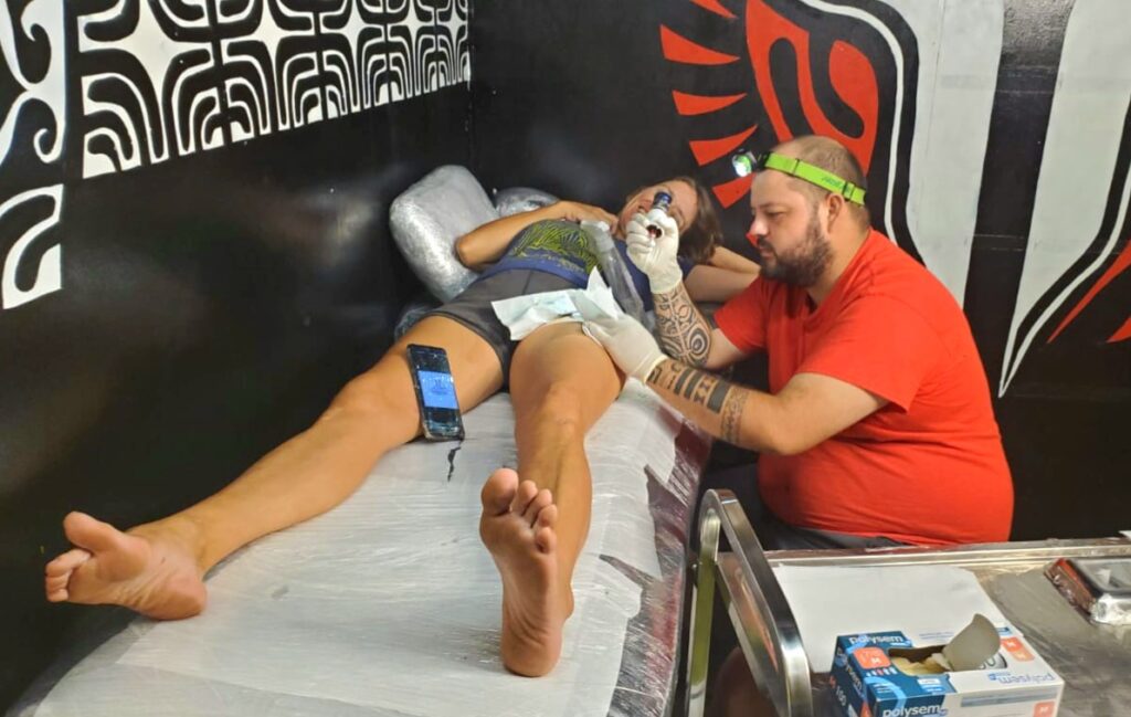 getting tattooed in Marquesas