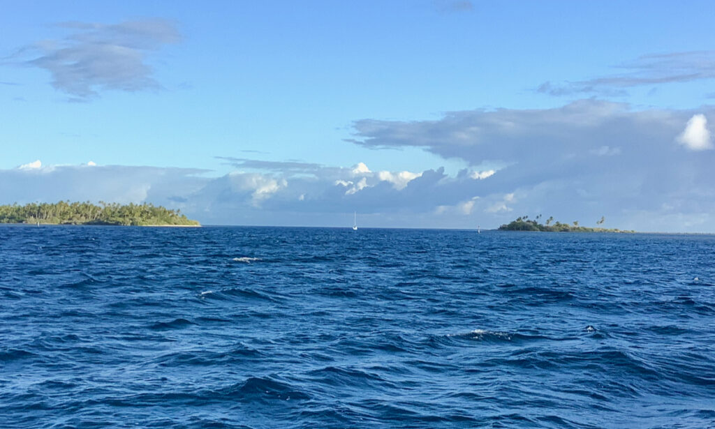 Sailboat approaching a pass