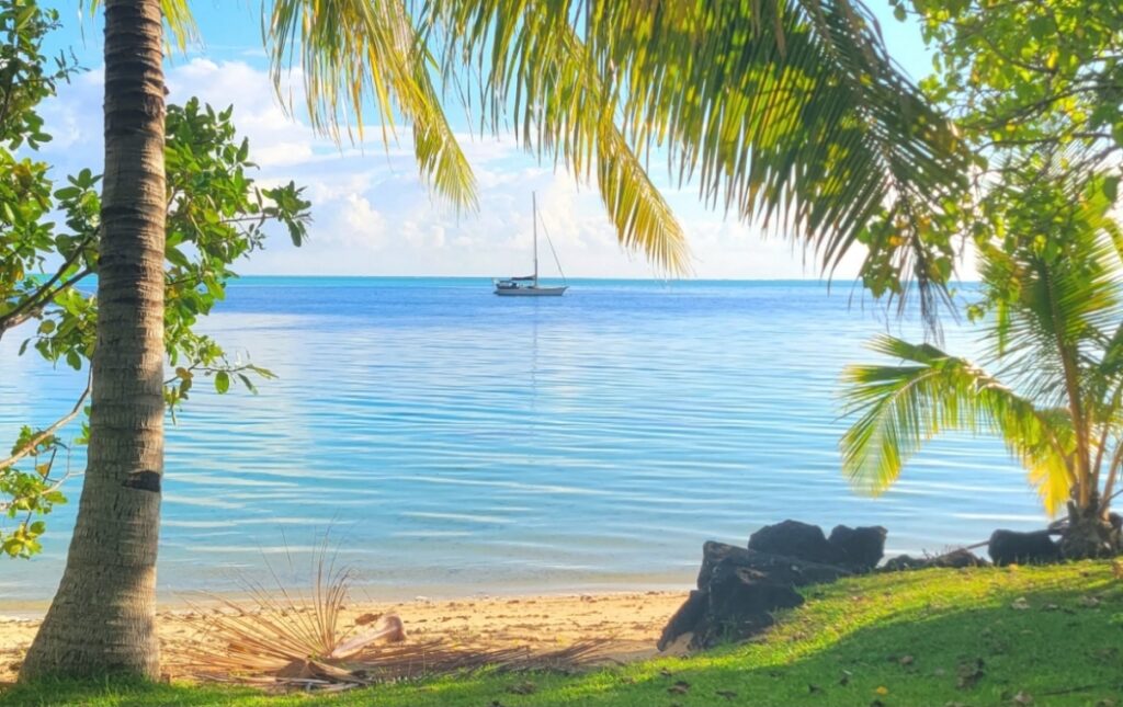 Sailboat moored in turquoise water, Huahine highlights, French Polynesia