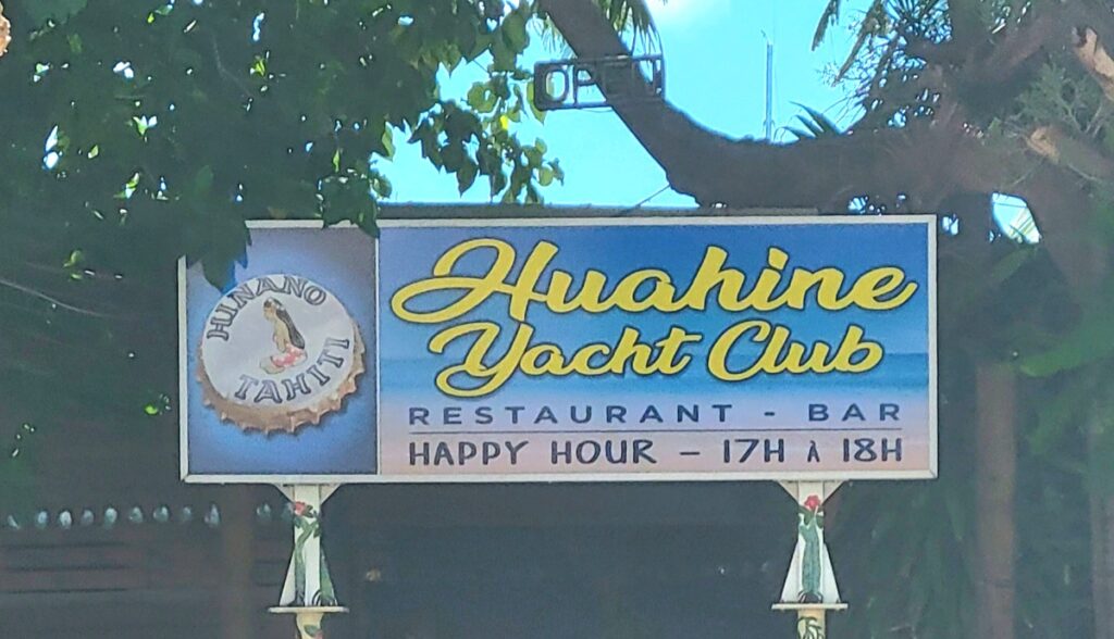 Huahine Yacht club sign. Happy hour 5-7pm