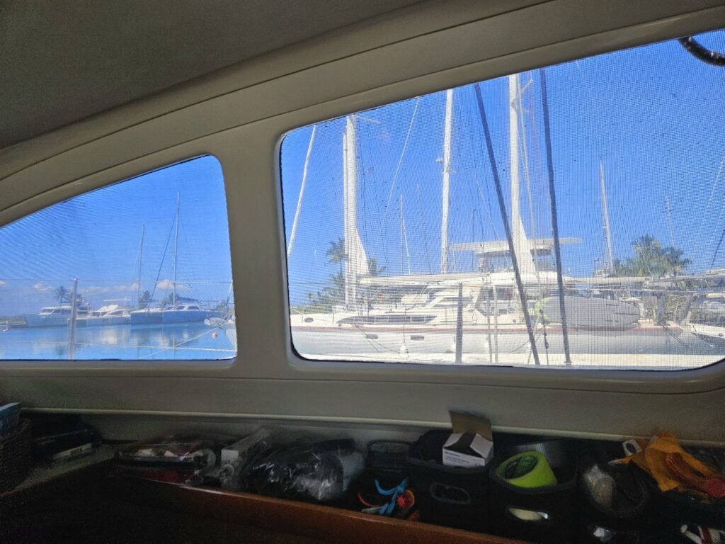 View out the portholes inside our new boat a catamaran