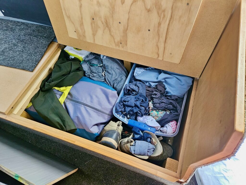 clothes and camping gear in storage space