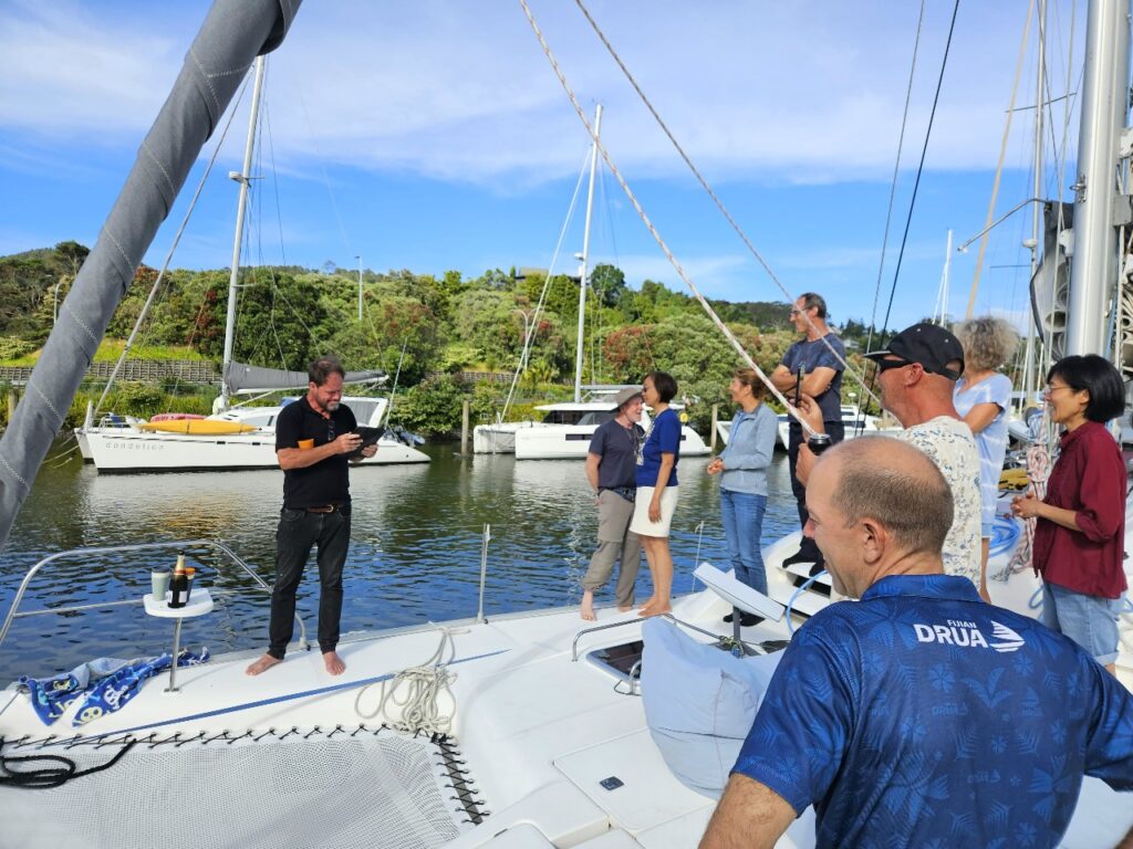 guests on the bow of catamaran, Whangarei town basin marina