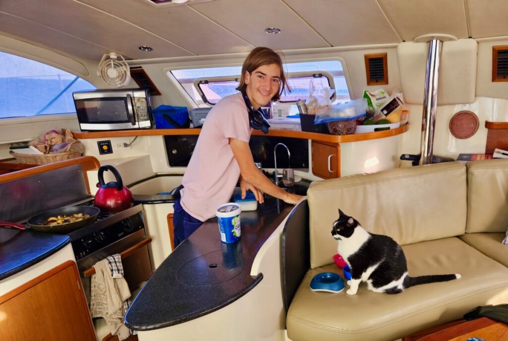 man and cat on a boat