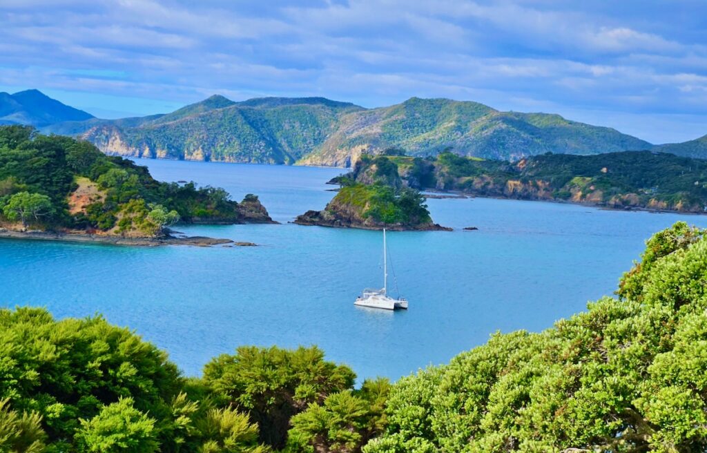 Catamaran anchored bay and mountains