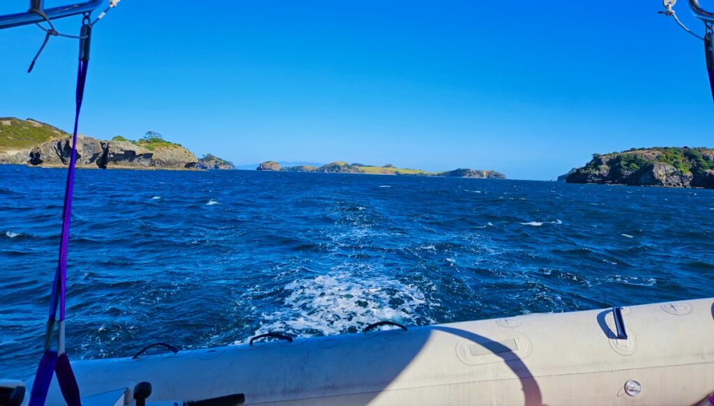 rear view from our sailboat, islands, wake