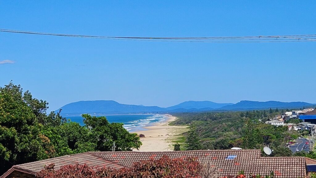 View of the beach from Tacking Point Lighthouse
