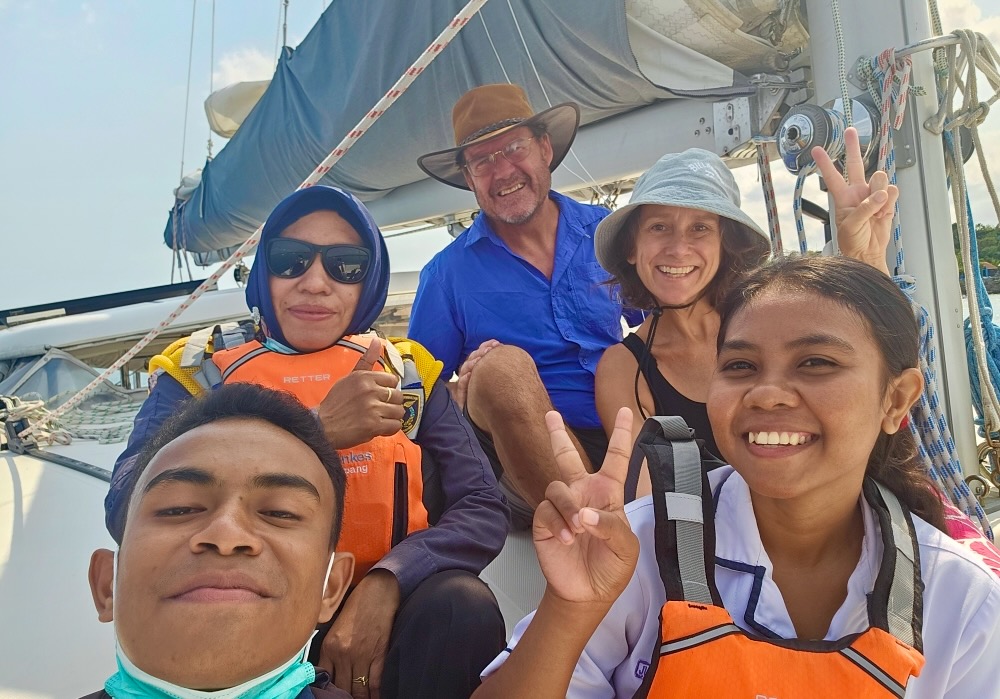 smiling people on sailboat, Eastern Indonesia highlights